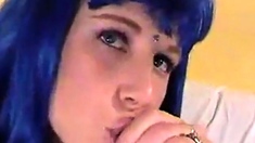 Blue wig crossdresser blowing