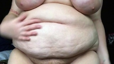 Busty curly brunette with big boobs fucks on couch