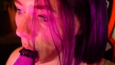 Redheaded pierced teen close up toy show
