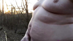 Chubby masturbates in the woods