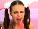 Cam girl with pigtails gagging on dildo